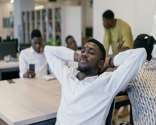 person taking a short break in a bright coworking space